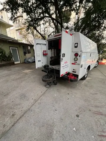 Magnet Plumbing service vehicle on-site for Grease Trap Cleaning in Quadrangle